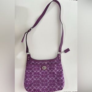 Magenta Coach shoulder/crossbody purse.